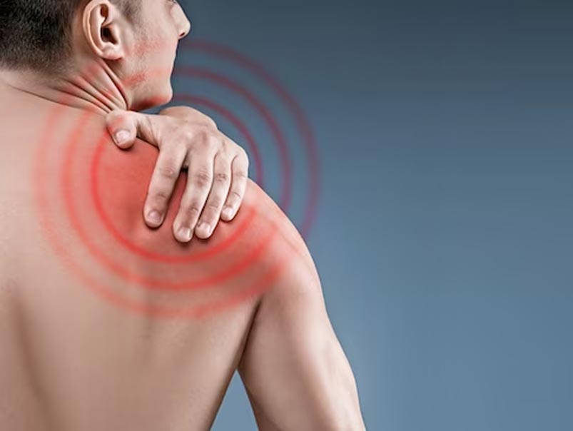 A man touching his shoulder and there is a circle highlighting the back area of the shoulder where he needs to have care from a professional chiropractor to care for his shoulder and enhance his mobility and function.